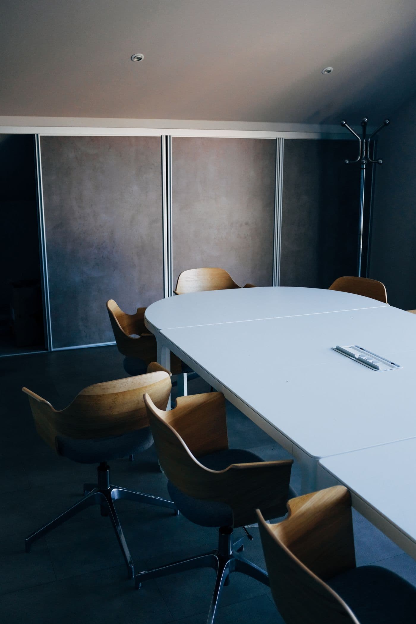 Empty meeting room with a long table and chairs