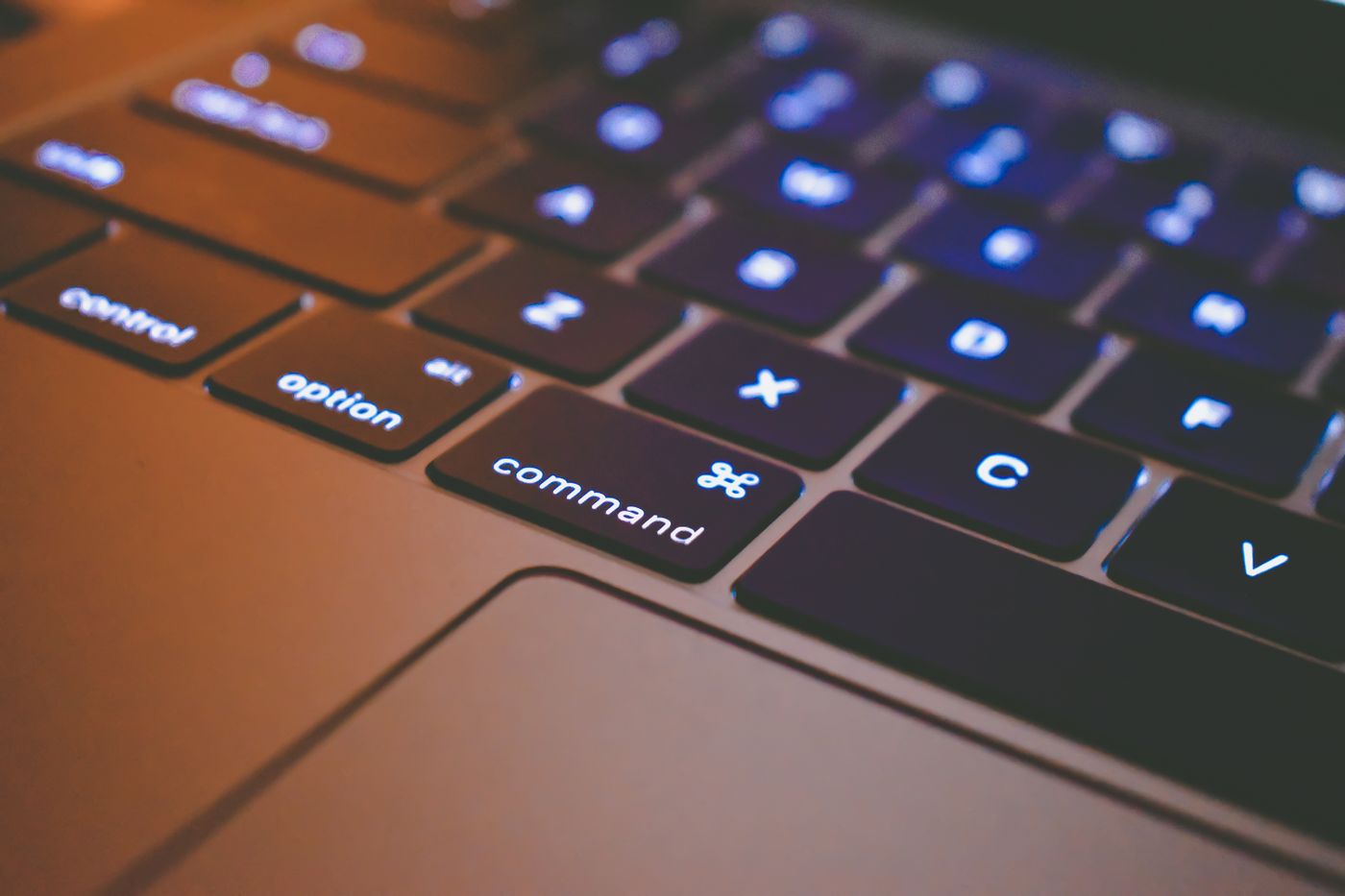Backlit laptop keyboard close up